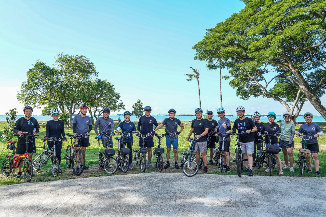 Group of people with bikes.