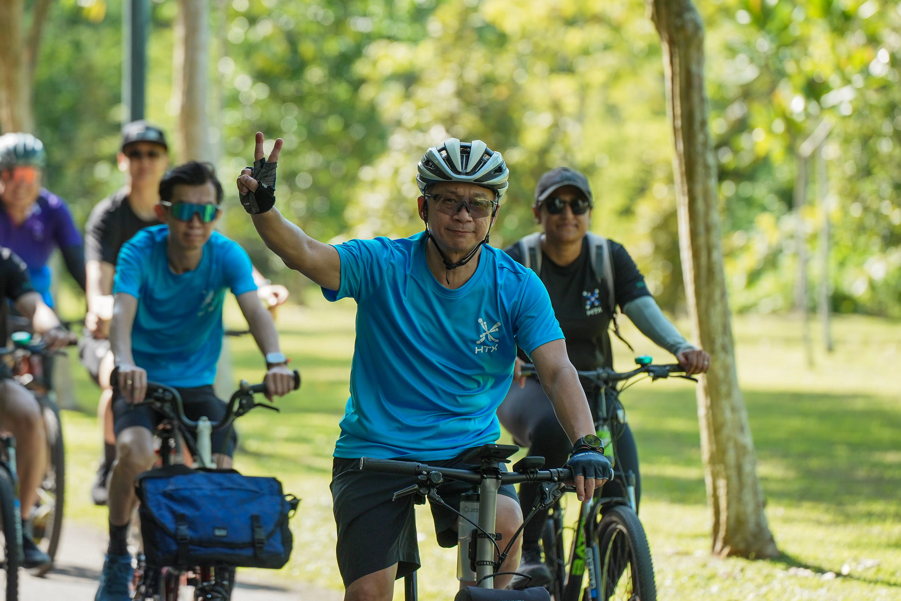 Group of people with bikes.